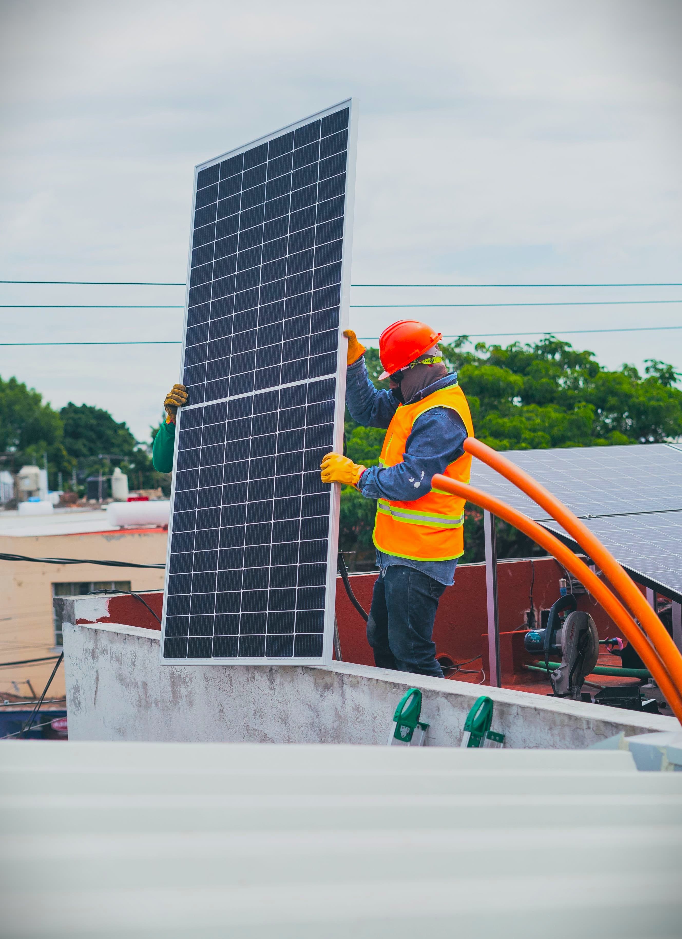 ROBUS solar energy technician installing solar panels